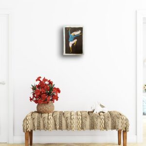 Artwork above a decorative table.