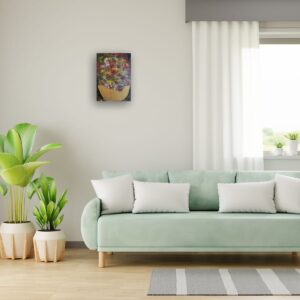 Bright artwork above a green sofa.